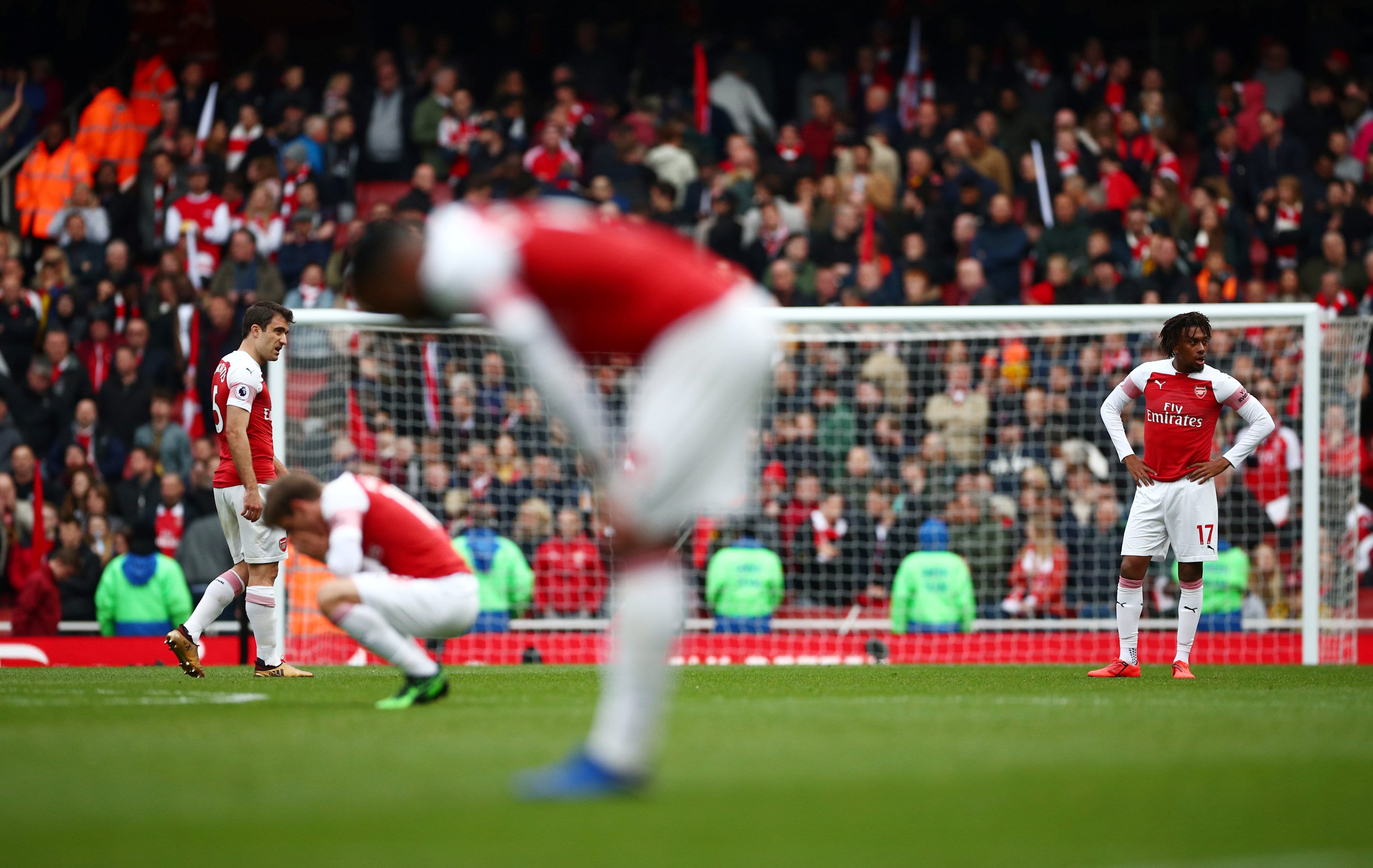 Arsenal's Sokratis Papastathopoulos and Alex Iwobi react after the match REUTERS/Hannah McKay
