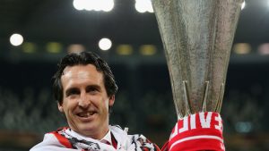 A picture of Unai Emery holding the Europa League trophy during his tenure as Sevilla manager