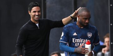 LONDON, ENGLAND - SEPTEMBER 12: Mikel Arteta, Manager of Arsenal interacts with Alexandre Lacazette of Arsenal after he is subbed during the Premier League match between Fulham and Arsenal at Craven Cottage on September 12, 2020 in London, England. (Photo by Paul Childs - Pool/Getty Images)