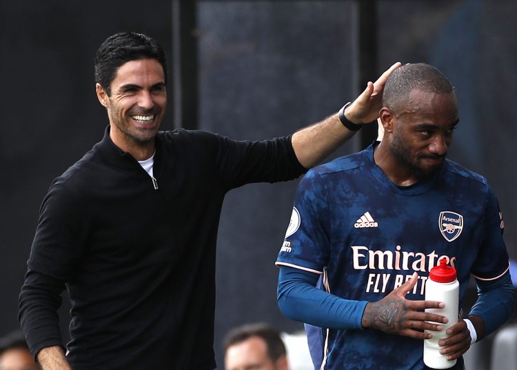 LONDON, ENGLAND - SEPTEMBER 12: Mikel Arteta, Manager of Arsenal interacts with Alexandre Lacazette of Arsenal after he is subbed during the Premier League match between Fulham and Arsenal at Craven Cottage on September 12, 2020 in London, England. (Photo by Paul Childs - Pool/Getty Images)