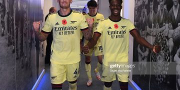 LEICESTER, ENGLAND - OCTOBER 30: (L-R) Arsenal's Ben White and Bukayo Saka celebrate after the Premier League match between Leicester City and Arsenal at The King Power Stadium on October 30, 2021 in Leicester, England. (Photo by Stuart MacFarlane/Arsenal FC via Getty Images)